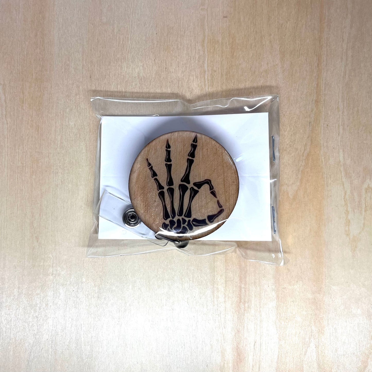 Skeleton Hand OK Badge Reel
