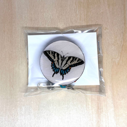 White Striped Black Moth Badge Reel