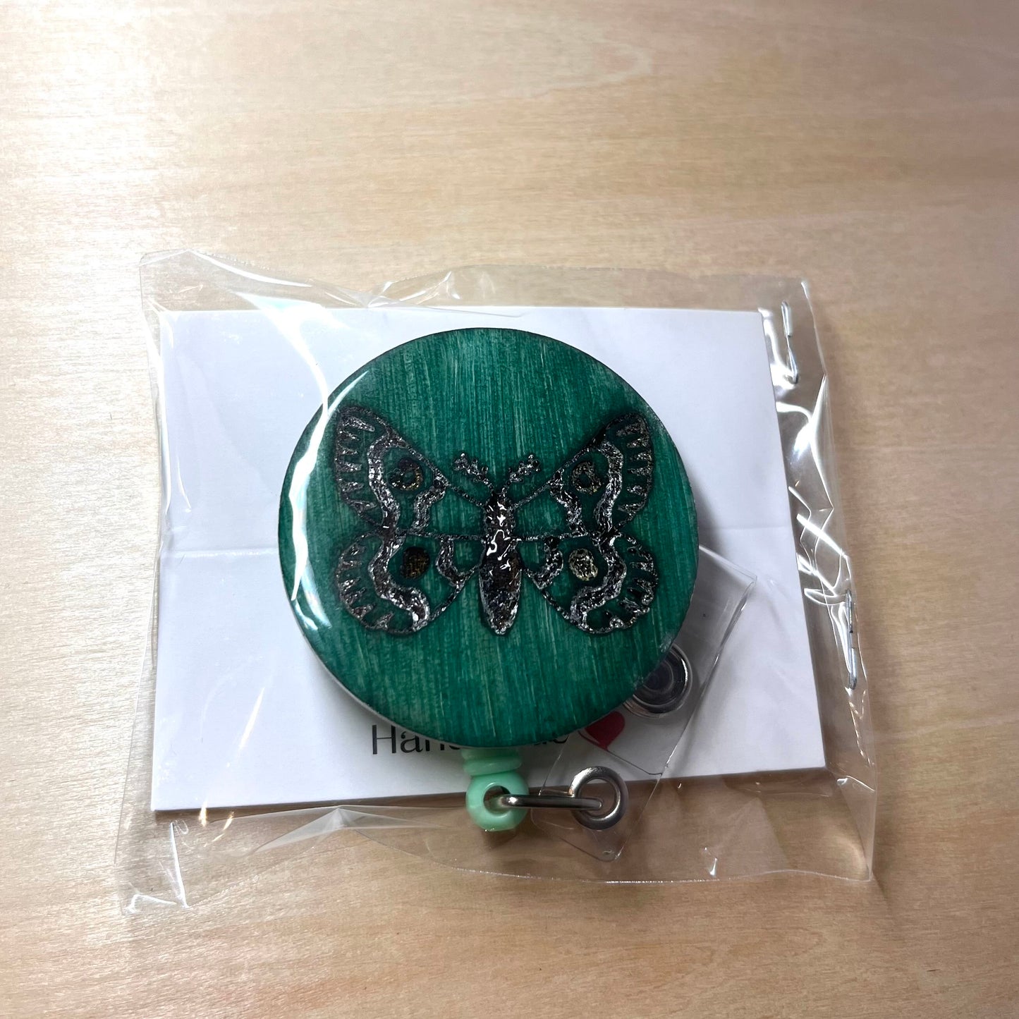 Moth Badge Reel