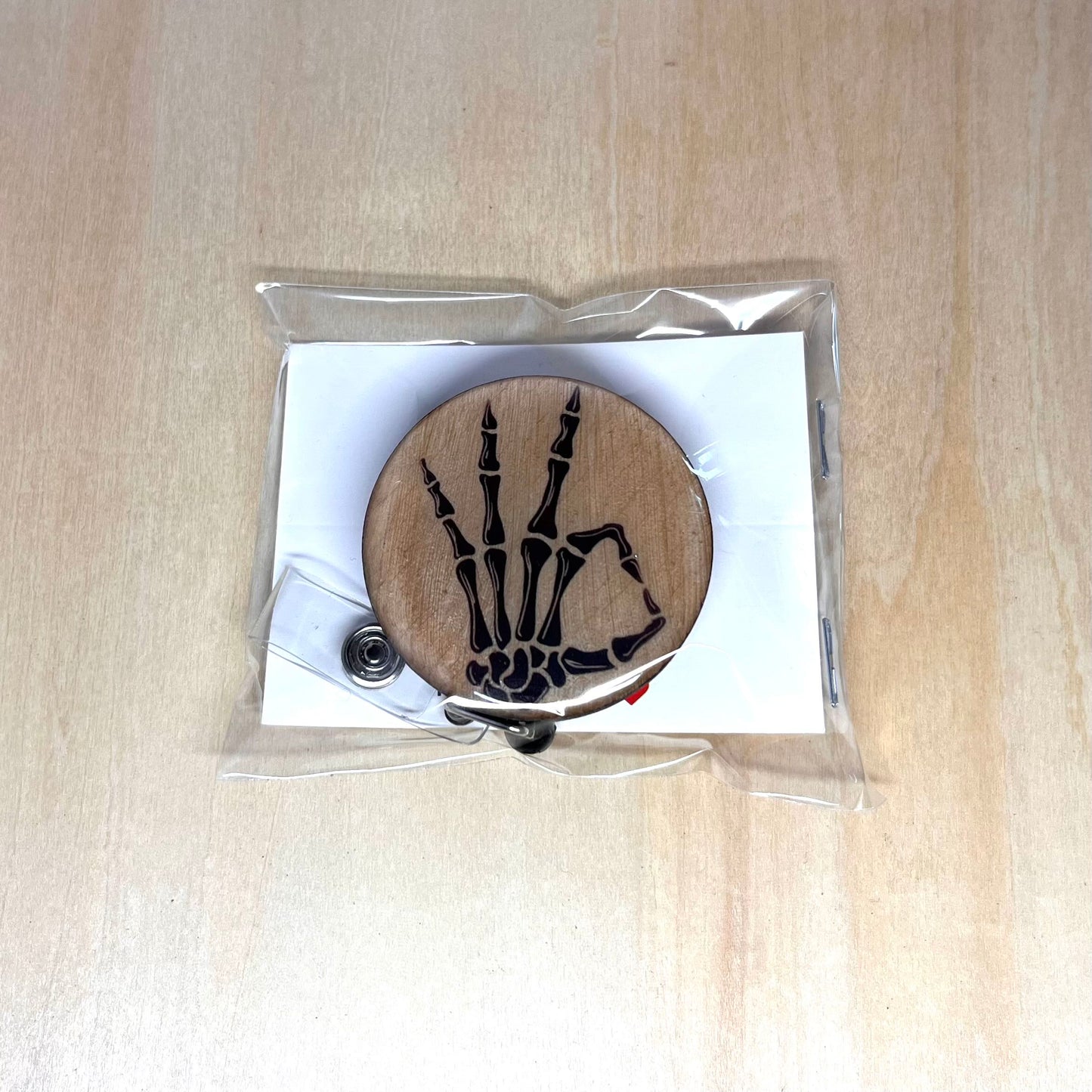 Skeleton Hand OK Badge Reel