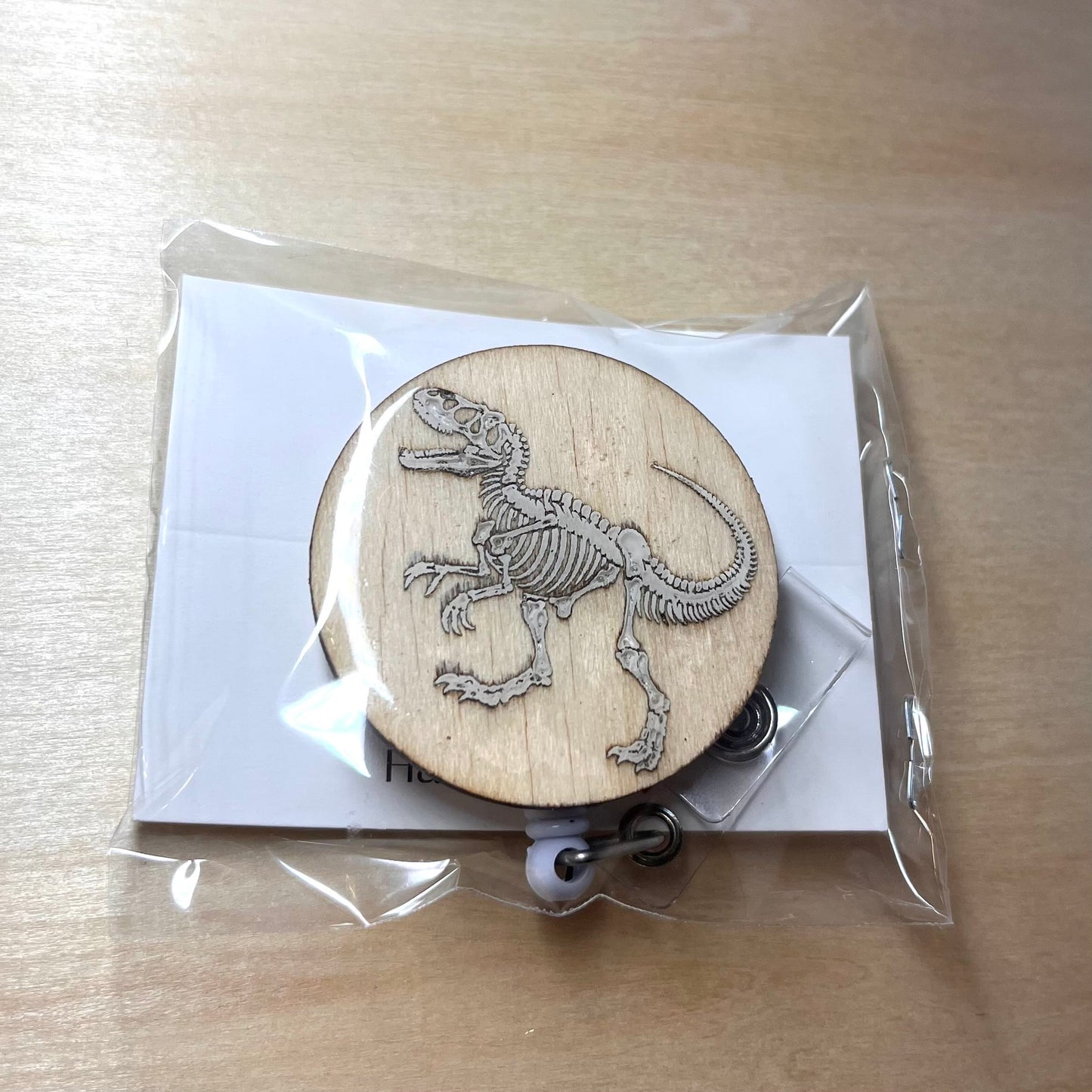 Skeletal T-Rex Badge Reel